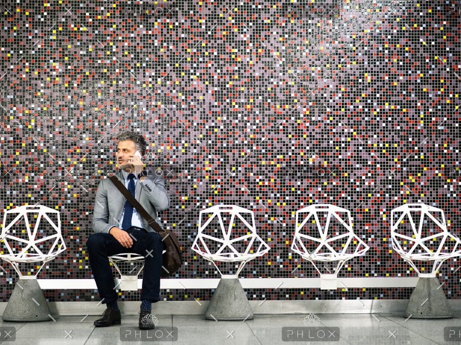 demo-attachment-40-Mature-businessman-with-smartphone-in-a-metro-station.